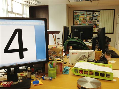The four desks in this working area belong to the office heroes
