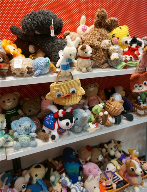 Shelves full of cute crochet plushies and bags