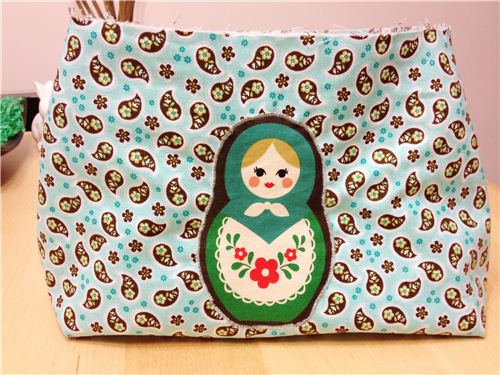 Not yet finished, but already very pretty. A Little bag sewed with our fabrics
